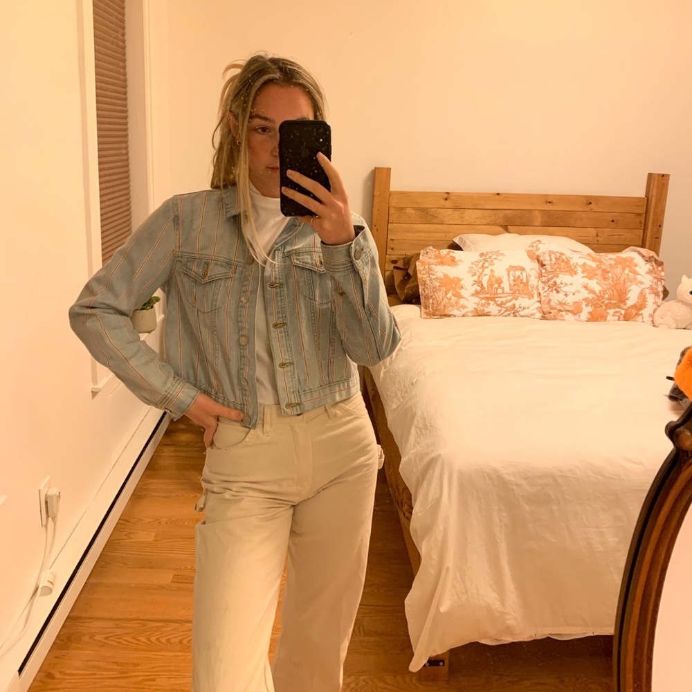 Light wash denim jacket with delicate red stripe